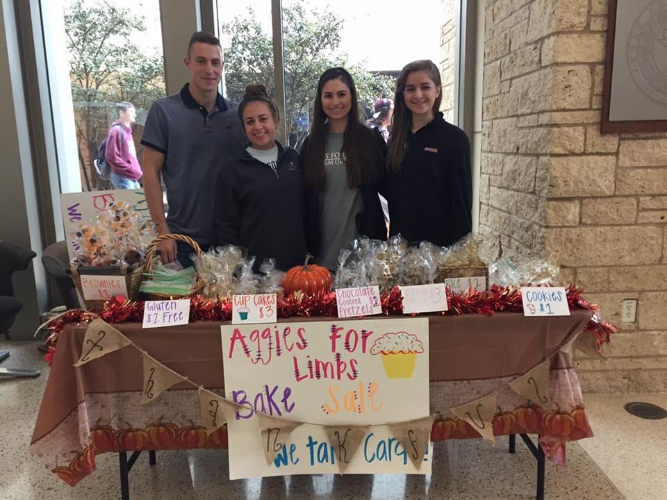 Fundraising Committee in action - Members hosting a bake sale fundraiser with decorated table and baked goods