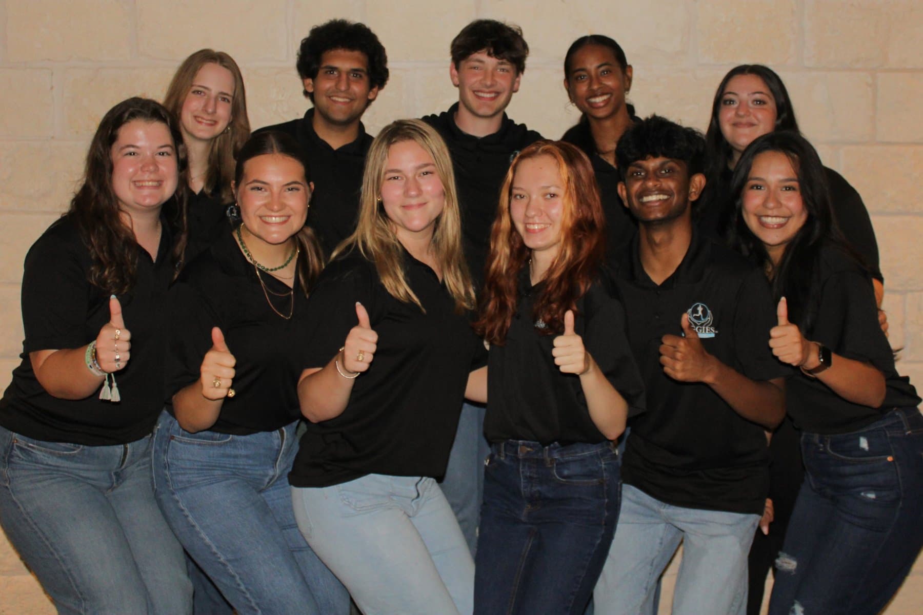 Aggies for Limbs Officer Team group photo showing officers in black polos